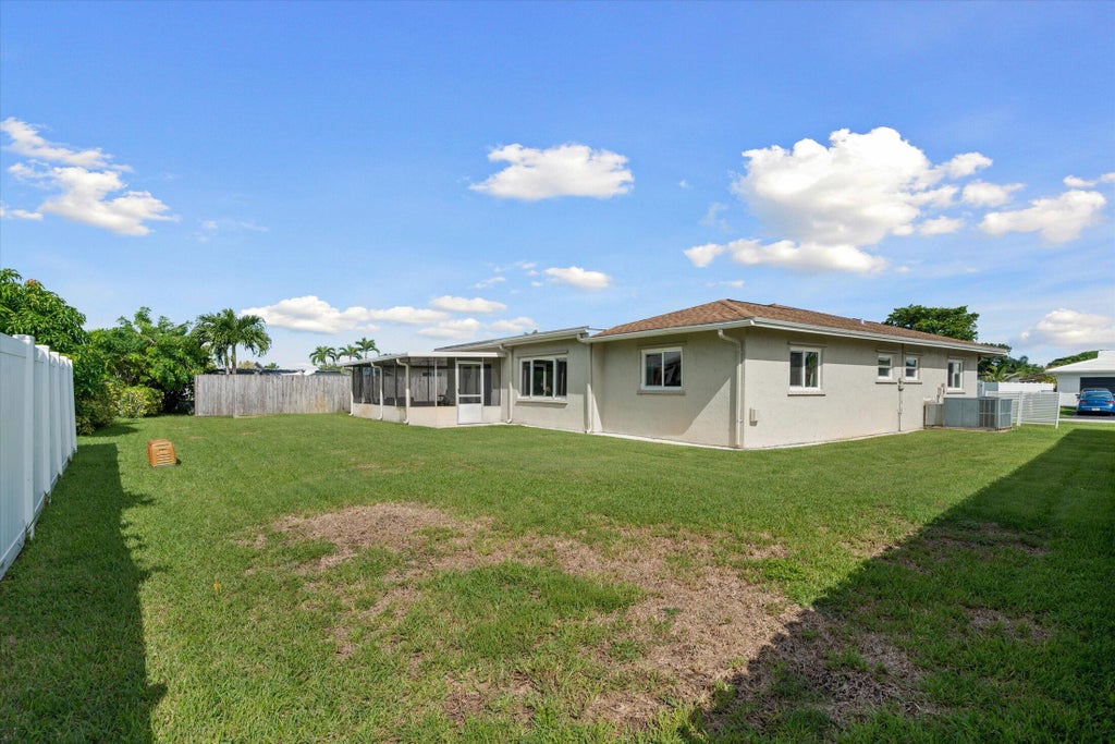 Photo of 9704 NW 67TH Street, Tamarac, FL 33321 (MLS # B26085576)