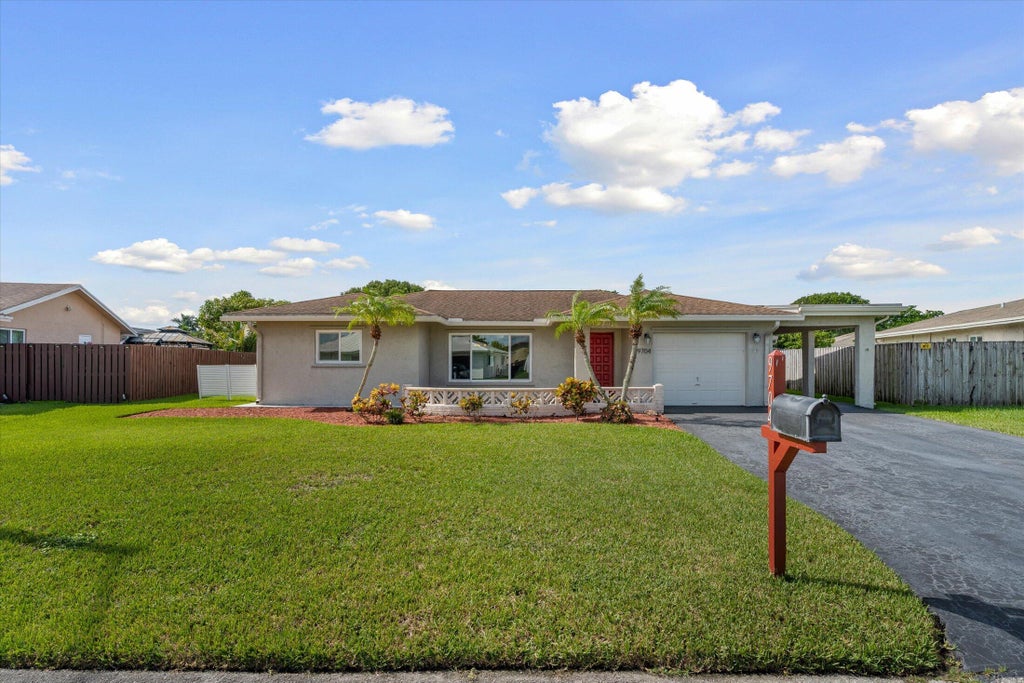 Photo of 9704 NW 67TH Street, Tamarac, FL 33321 (MLS # B26085576)