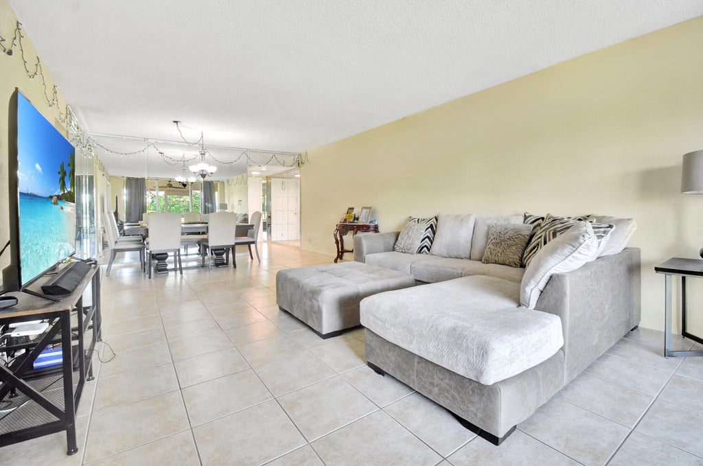 Photo of 2671 S COURSE Drive #105, Pompano Beach, FL 33069 (MLS # B26092089)