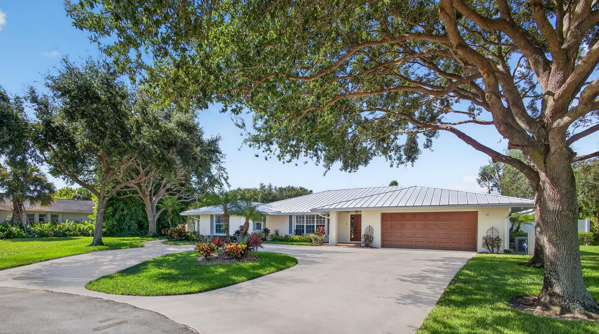 A hidden gem! Step inside and you'll find a world of quiet luxury. 4 bedroom 3 1/2 bath pool home with office that includes custom wet bar. Brand new metal roof and gutters with screen covering. Newly painted inside and out. Updated granite kitchen and baths. Remodeled primary bath includes air tub and oversized walk in closet with island results in sizeable increase in sq, ft.. Salt water pool, travertine patio, fire pit, and complete baby barrier. 20KW Kohler Whole House Generator. 1,000 Gal Underground LP Tank. Newer central vacuum system and 3 hot water heaters. PVC privacy fence. New sink and counters in laundry room. Total hurricane coverage. Termite bond on home. This quality home features a neutral color palette with subtle accents. and is designed for comfort and ease of living.