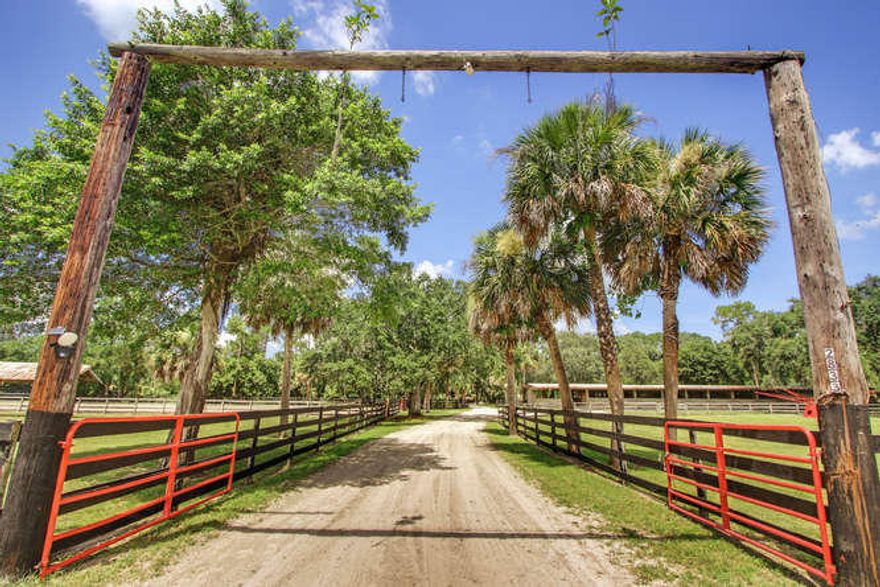 Rare opportunity to own 20 acres just minutes from Wellington! Ideal for developers—property may be subdivided into four 5-acre parcels. Located on a paved road with easy access to Okeechobee Boulevard. Features include a 2BR/1.5BA ranch home, separate mobile home, and a 26-stall barn with tack room & wash rack. Property also offers paddocks, arena &  round pen. Penty of space to expand or build a custom equestrian facility or polo field. Steps from Royal Palm Beach Pines Natural Area with 700+ acres of trails.
