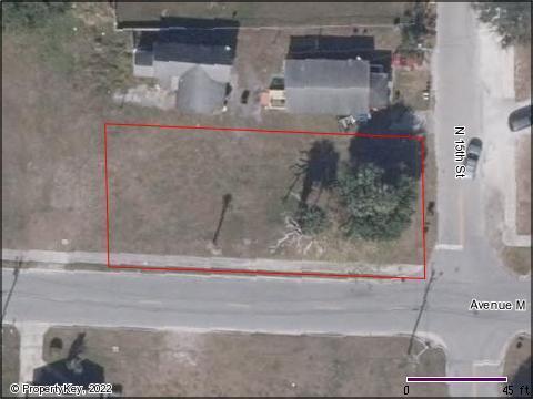 Mostly cleared corner lot on the NW Corner of Ave M and N 15th St in Fort Pierce.