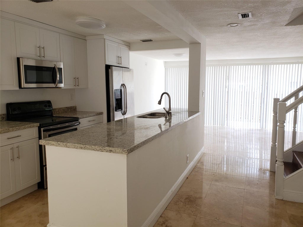 Photo of 851 NW 81ST Terrace #8, Plantation, FL 33324 (MLS # B26082072)