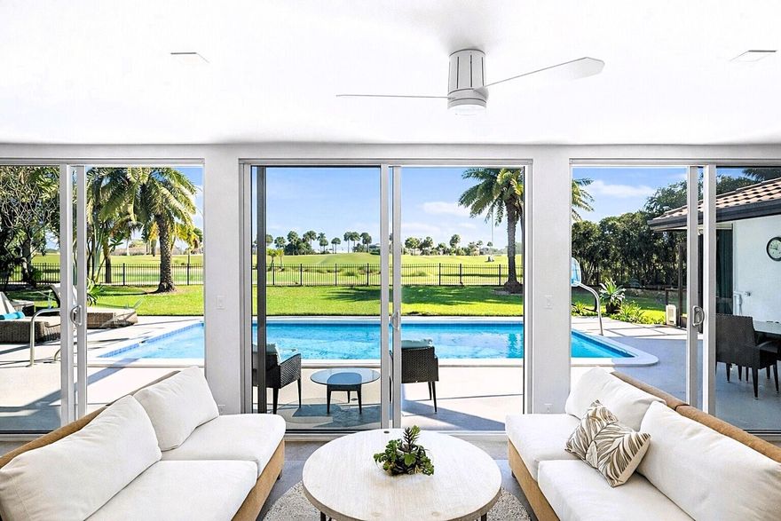 Tour this open concept floor plan home that will not disappoint! CBS Construction, no flood zone! Once entering, you are immediately greeted by spectacular views of the pool and golf course. The modern kitchen with top-of-the line appliances including a built-in Miele coffee station and tons of storage is a chef's dream.  The home was modernized to perfection and is perfect for entertaining. The screen enclosure will be removed late March as depicted on 2 AI generated images. Both master bedroom and the north-side guest room have en-suite baths and lead directly to the pool deck. The glass garage door brings in natural light. Being only 2 lots away from the shortcut to the Country Club makes this a very desirable location. Please see attachments for a detailed feature sheet and floor plan.