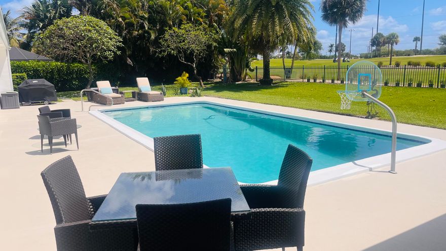 Unobstructed Views from this stunning 5 Bedroom plus Den home overlooking the North Palm Golf Course will not disappoint. 3,578 sf under air and 4,220 sf total, plus an oversized pool make this home perfect for large families! Once entering, you are immediately greeted by spectacular views of the pool and golf course. The open concept floor plan and high-end finishes are impressive. The open kitchen features top-of-the line appliances and even a built-in Miele coffee station. The home was completely modernized to bring the ''outside in and the inside out'' and is perfect for entertaining. Both the master bedroom and the north-side guest room have en-suite baths and lead directly to the pool deck. The large backyard features a meditation area, lush landscaping and room for a summer kitchen. Please note that the screen enclosure for the pool deck was just removed and are still pictured in some photos. Being only 2 lots away from the shortcut to the Country Club makes this a very desired location. North Palm is golf-cart friendly. Walk, bike, or take your golf cart right up to the club for happy hour, tennis, or a game of golf. Don't miss the opportunity to tour this amazing property!