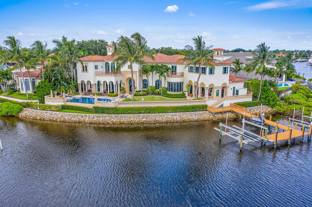 A true masterpiece built by Turtle Beach Construction awaits you. This custom built, thoughtfully designed home has everything one could want. There are multiple places to entertain from the club room with a built in bar to the open great room adjoined to the gourmet kitchen, theater room and summer kitchen that leads to the amazing outdoor space that has spectacular sunsets. You will want to spend countless hours taking in the water views relaxing by the infinity edge pool that feels like it cascades into the panoramic waterway and in the distance a bird sanctuary that is memorizing. Grand formal space, solid marble columns, Venetian plaster, hand painted moldings, high end appliances, a guest house and so much more! This home is sophistication and magnificence at it's best.