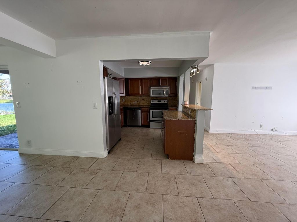 Photo of 224 Tamoshanter Drive, Palm Springs, FL 33461 (MLS # B26022166)