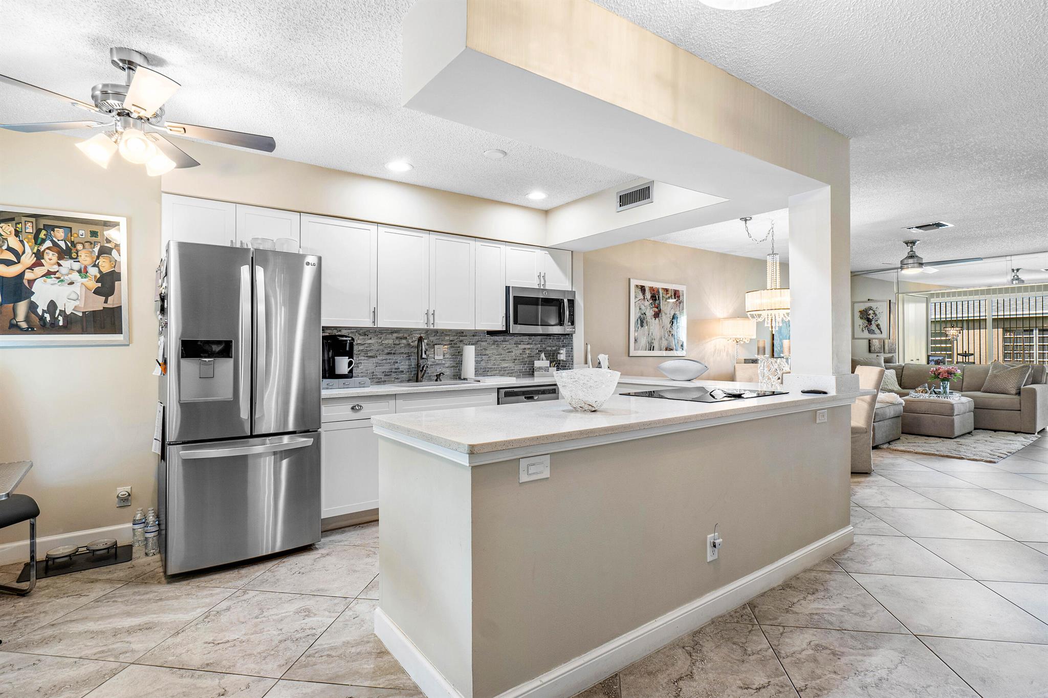 Experience the perfect blend of style and convenience in this beautifully remodeled 2nd-floor condo with no neighbors above! Featuring a modern open-concept design, the completely updated kitchen and bathrooms are equipped with top-of-the-line finishes. All impact windows provide peace of mind and energy efficiency. Located in an active adult community, you'll enjoy a vibrant lifestyle with amenities and social activities.