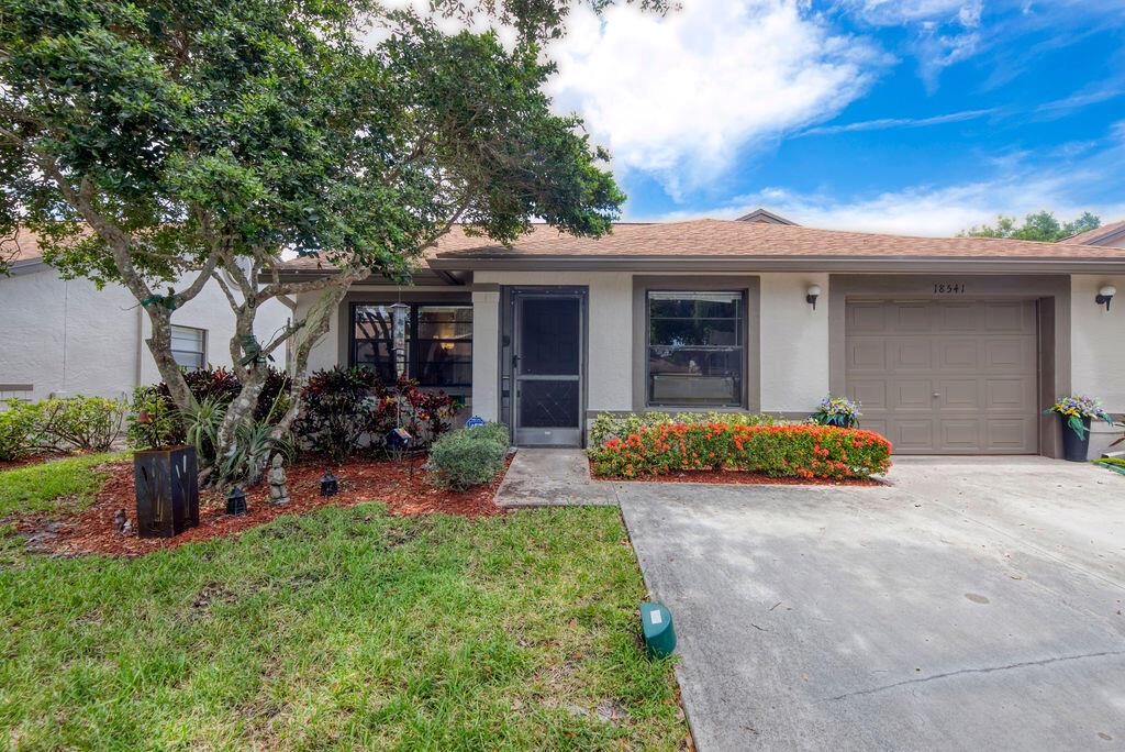 Rarely available true 3-bed 2-bath corner unit in desirable community. One of the largest models with cathedral ceilings and a split floor plan for added privacy. New floors and new hot-water heater. Spacious master suite with sitting area, double door entry, and huge walk-in closet. Relax in your glassed-in Florida room in the AC or walk out to your open private patio. Whisper Walk has a clubhouse, resort pool, spa, tennis, and pickleball. Clubs and card games, along with walking paths and lakes. Great community and a must-see unit!