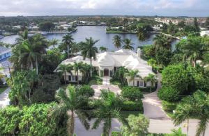 Sited on an incomparable setting in the heart of Gulf Stream, this elegant estate home on Polo Cove, the most sought after waterfront location in the area, is ready for the discerning buyer.  Featuring 150’ of water frontage on the protected cove, this residence is graced by astonishing views from all angles.  A grand foyer opens graciously and flows effortlessly to a spacious and generous living and formal dining room with breathtaking water views from almost every window.  Custom built, the home is replete with dramatic details throughout. Ideally located within 20 minutes of Palm Beach’s International Airport or the Private Air Terminal of Boca Raton transportation is easily accessible.  World class beaches of Gulf Stream and Delray are close by as well as fine dining and shopping of of the famed Atlantic Avenue.