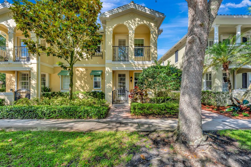 Discover the perfect blend of comfort and style in this meticulously maintained and incredibly rare 4-Bedroom, 3-Bath San Palermo townhouse, offering 1830sf of bright and inviting interior space.  This home, a part time lightly lived in residence for its longtime Owners, boasts a southerly rear exposure, flooding the property with natural light throughout the day.  Smart details include Owner upgraded sound-quieting, energy efficient impact windows and accordion storm shutters for doors, ensuring tranquility and safety.  The garage is almost as fabulous and spotless as the home itself, with a recently finished poplyaspartic epoxy floor, custom cabinetry, shelving and workbench with multiple added electrical outlets.    Step inside to find a welcoming open floor plan featuring sleek maple- stained hardwood planked floors, along with newly tiled (porcelain) kitchen and downstairs bath.  The open kitchen is a chef's dream, with premium counters, recessed lighting, stainless steel appliances, and a convenient breakfast bar for casual dining.  The adjoining dining alcove offers the perfect setting for meals and gatherings.  The private primary ensuite upstairs includes a spa-like soaking tub, a double-sink vanity, and a spacious walk-in closet.  The laundry room is conveniently located off the hallway between the 3 upstairs bedrooms.   A 4th bedroom and 2nd ensuite with private entry  is easily created right on the ground floor!  This flexible space is currently configured as a library/den with a pull out sofa for extra guests and includes a just completed (March 2026), never-before-used bathroom w/ gorgeous walk-in shower.    Relax and and entertain outdoors on your custom lit, polyaspartic epoxied, screen enclosed perfect sized courtyard (35 x 17ft, almost 600sf!) where you can enjoy Jupiter's stunning weather and grilling year round.  This area is semi-secluded, defined by 7ft side walls and the end wall of your detached garage separates you from your neighbors.  Beyond your rear loading garage and alley way lies a magnificent  heavily treed and open green park-like and peaceful common area.    Move-in ready, this townhouse is an outstanding opportunity to own a beautifully upgraded home with modern features and timeless charm.  Let me show you everything this special property has to offer.  It won't last long.