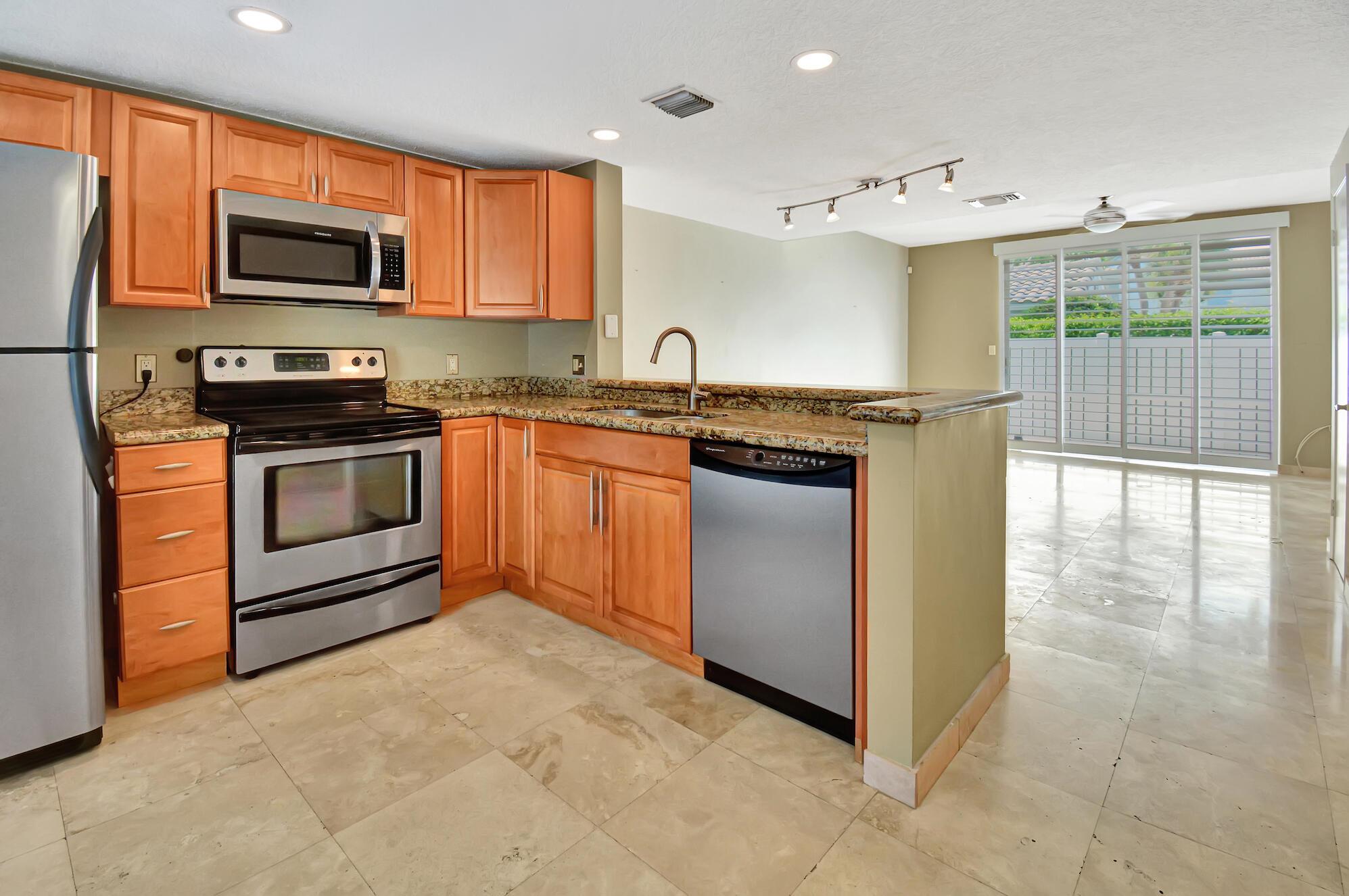 Available MAY 1st, 2024 for an unfurnished anual lease. Welcome to the quaint community of Boca Quay! This cozy 2 story townhome is located perfectly in a waterfront community minutes from the famous Mizner Park & Atlantic Avenue. Both FAU Campus and the Brightline stop are quick five minutes away. The first level features an open kitchen and living room with a half bathroom and a spacious patio off the living room, enclosed with a pvc fence. Upstairs features two master bedrooms with ensuites and a washing machine and dryer. Two parking spaces, water, exterior, roof, and pest maintenance included. Community Pool is located directy behind the unit for private access. Just steps to the intracoastal, enjoy a glass of wine and watch the boats go by! Showings start now, allow 24 hour notice.
