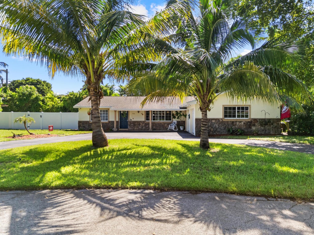 Photo of 7400 Clarke Road, Lake Clarke Shores, FL 33406 (MLS # B26079463)