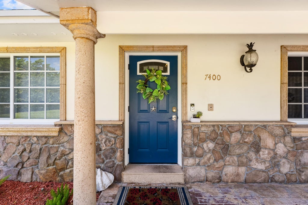 Photo of 7400 Clarke Road, Lake Clarke Shores, FL 33406 (MLS # B26079463)