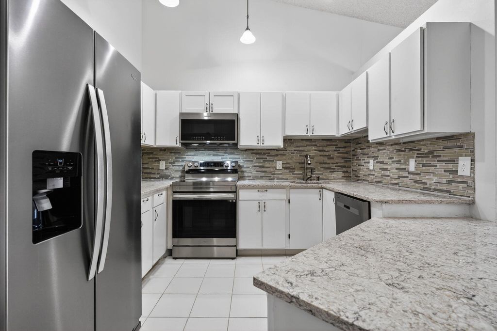 Photo of 6572 Chasewood Drive #F, Jupiter, FL 33458 (MLS # R11162518)