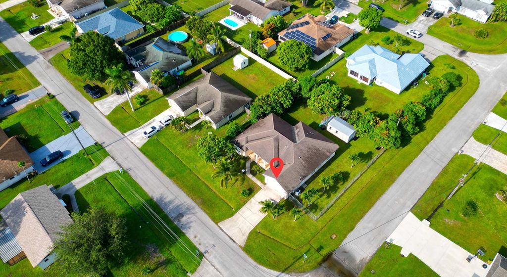 Photo of 1518 SW Hutchins Street, Port Saint Lucie, FL 34983 (MLS # R11121906)