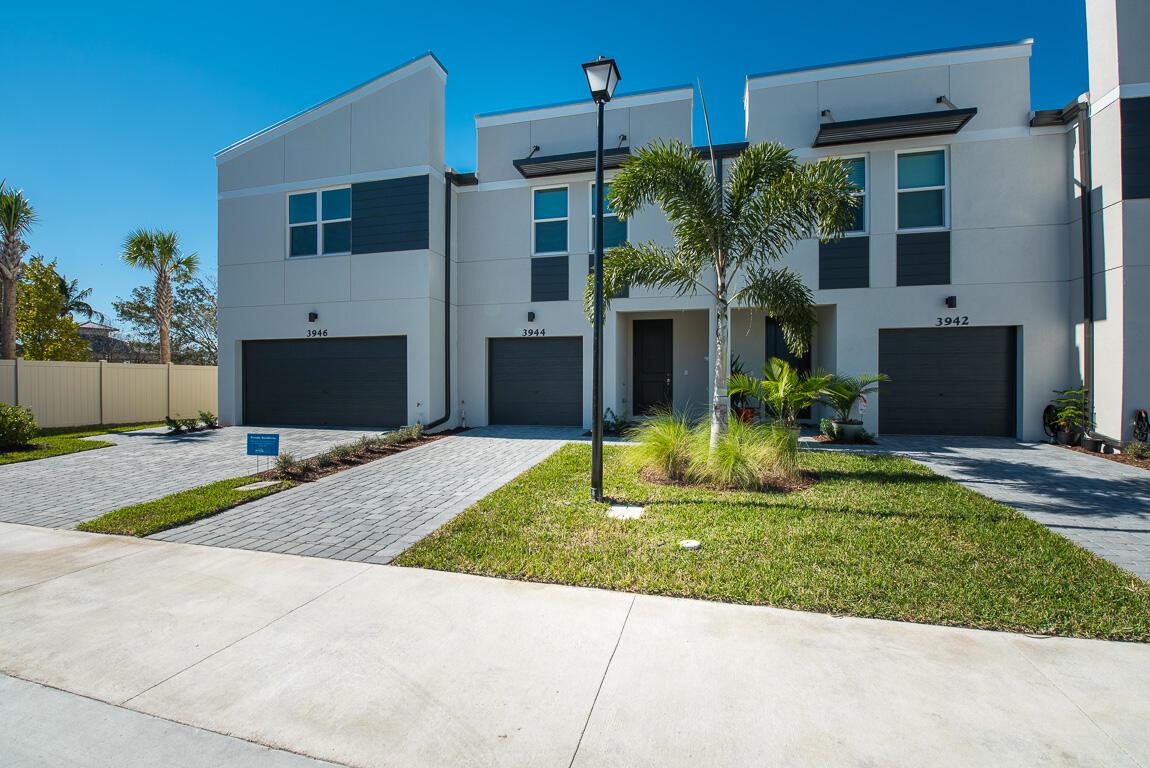 ONLY first and security! NO last month needed. Nearly new townhouse offering beautiful tile flooring in the living area, SS appliances, impact windows, smart lock, USB outlets, advanced thermostat, ceiling fans in every room, full size washer and dryer and one car garage. Trillium is a gated community ideally located close to shopping, dining and the beach and has a beautiful pool. You will love it!