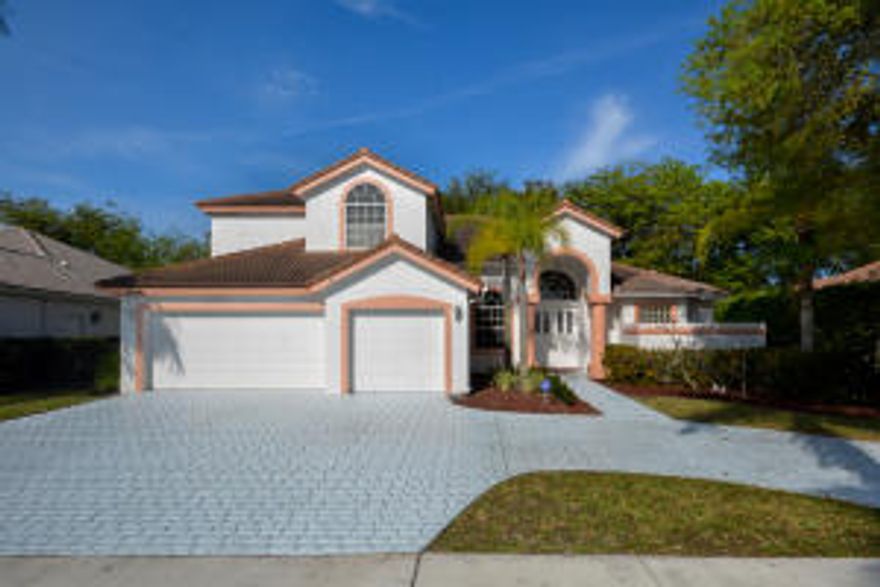 Highly sought after San Francisco model in Boca Falls!  Offers master and one bedroom down and 3 bedrooms up.  New tile floors throughout downstairs living areas and kitchen.  Very well maintained home by original owner.  Covered patio with screened in pool.  Walking distance to ''A'' rated Waters Edge Elementary.  Boca Falls is a NON-EQUITY community featuring 2 manned gates, a private gate to Waters Edge Elementary, six tennis courts with league play and on-site pro, outdoor basketball court, playground, fitness center, clubhouse and heated resort style pool.  Osprey Point public golf course is within 2 miles from the community.  Best value for 5 bedrooms in Boca Falls- don't miss it!