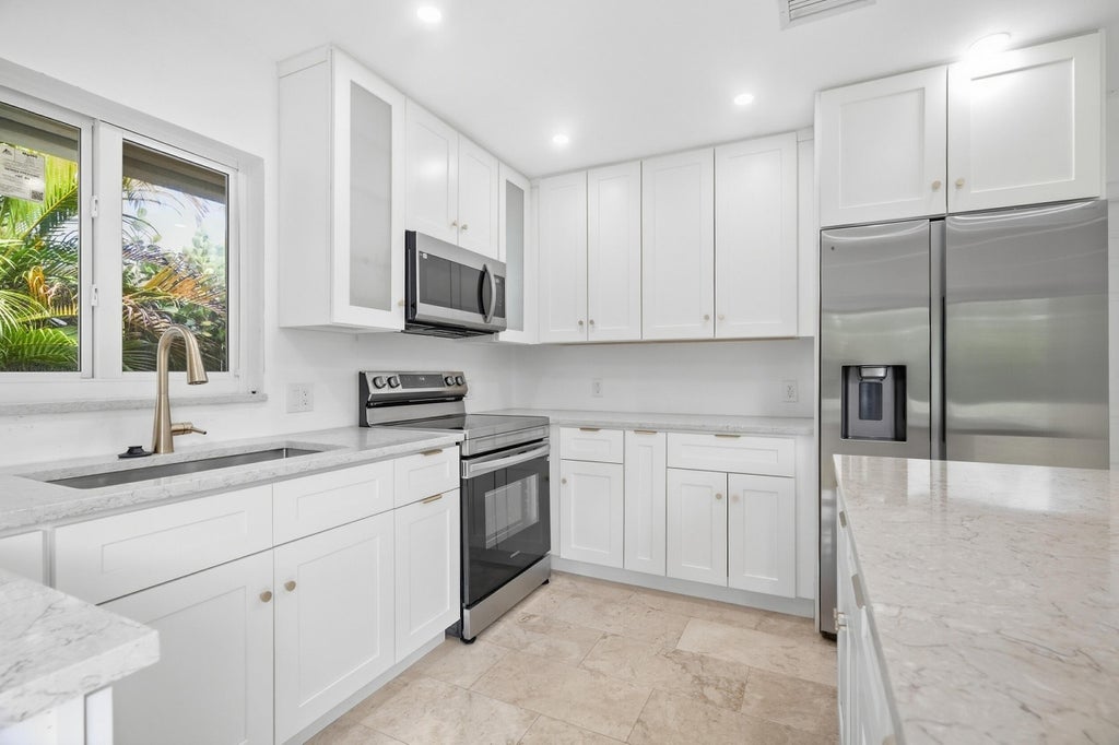 Photo of 235 NW 3rd Court, Boca Raton, FL 33432 (MLS # B26077723)