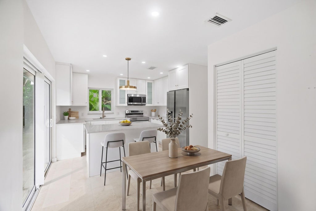 Photo of 235 NW 3rd Court, Boca Raton, FL 33432 (MLS # B26077723)