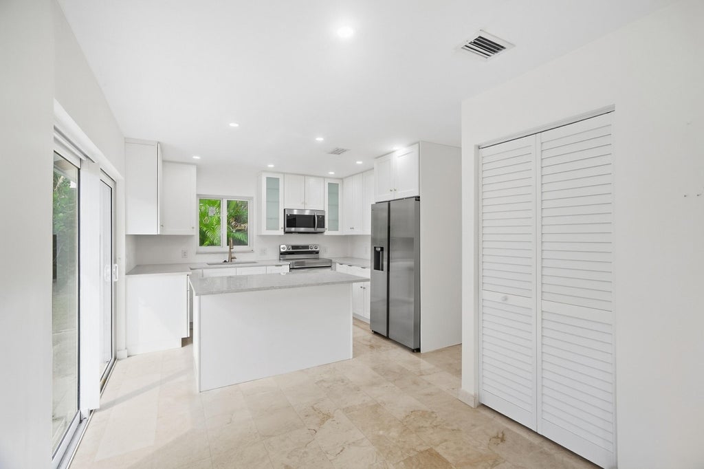 Photo of 235 NW 3rd Court, Boca Raton, FL 33432 (MLS # B26077723)