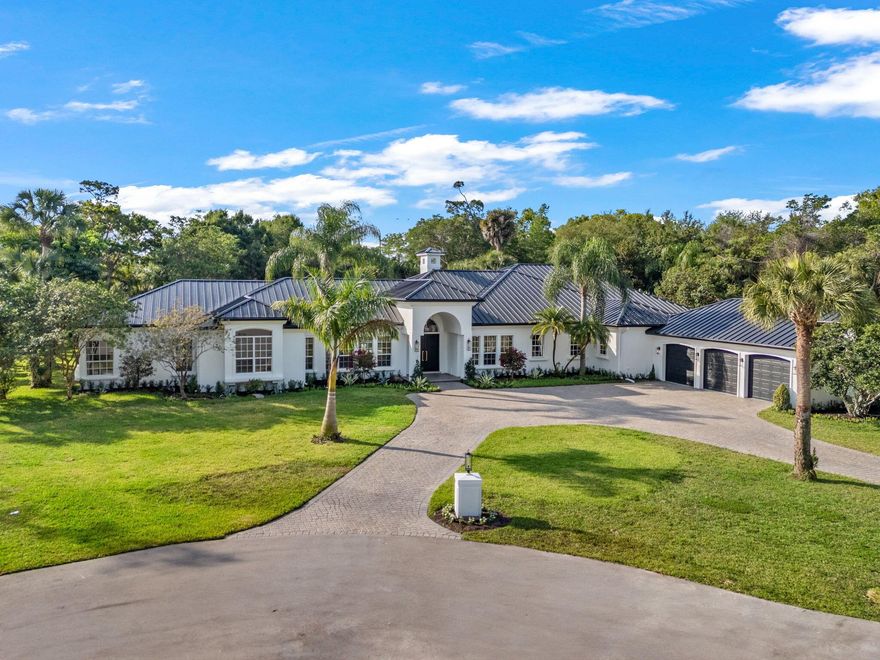 Nestled on a private 1.32-acre cul-de-sac lot with no HOA, this completely renovated estate blends sophistication with resort-style amenities. A new metal roof, impact windows, and whole-house generator provide peace of mind, while the drive-through circular driveway makes a striking first impression.Inside, you'll find elegant finishes, gas appliances, and a reverse osmosis water system. Outdoors, enjoy the ultimate retreat with a saltwater pool, outdoor kitchen, half-court basketball/pickleball court, and expansive yard space--perfect for entertaining or relaxing in total privacy.A rare Wellington gem offering luxury, function, and lifestyle without compromise.