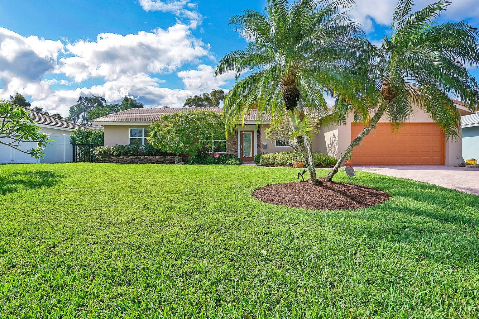 MOVE-IN READY SEPT 15TH! Very PRIVATE, beautifully landscaped backyard with large screened patio and pool area for BUG FREE living! Impact glass, full-size laundry room w/tub and additional cabinets. Kitchen has granite counters, tons of cabinets and pantry. All bathrooms are beautifully updated. Master has walk-in closet and hardwood floors, French doors to the pool and ensuite bath. 2 car garage, available alarm system, fenced backyard and NO CARPETS! Backs up to Hillsboro Cove. Little Harbor is a small, exclusive enclave, surrounded by water, with homes from $1m to $6m. The location is by far, the best. Little Harbor is across from shopping, restaurants, fitness, walk to famous DEERFIELD BEACH PIER! Freshly painted. Landlord pays lawn care and pool service... HURRY!