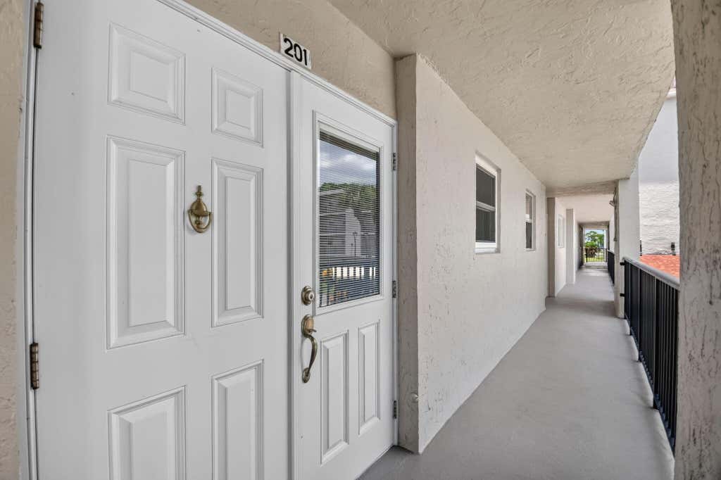 Photo of 3425 Via Poinciana #201, Lake Worth, FL 33467 (MLS # B26058145)
