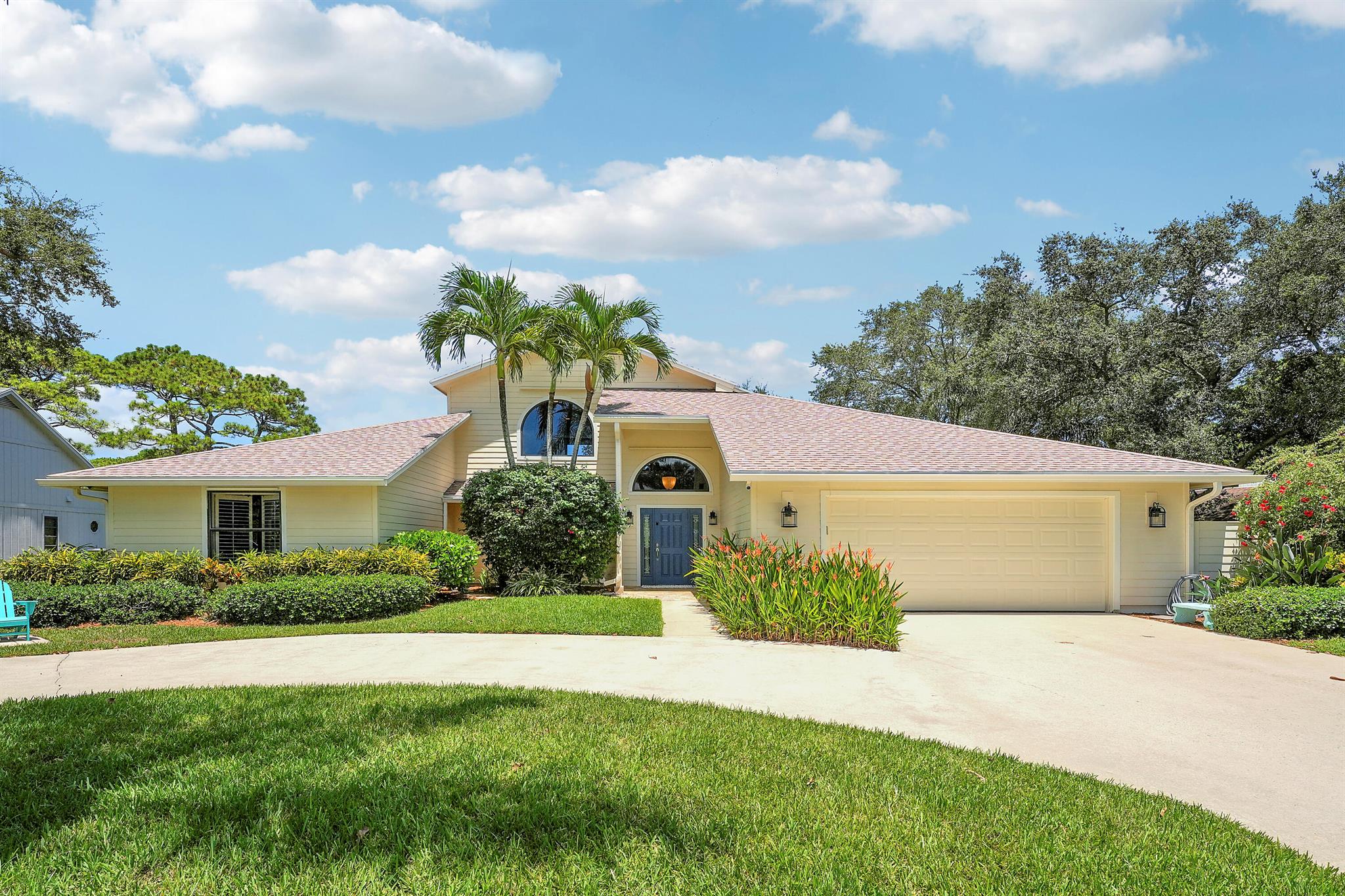 Lakefront Living in the Heart of Jupiter. Welcome to this well appointed 4 bedroom, 2-bath home (4th bedroom is a versatile loft), offering nearly 2,500 square feet of open-concept living on a half-acre lakefront lot. Soaring ceilings and abundant natural light create an airy, inviting atmosphere throughout.The spacious kitchen is a chef's dream, featuring a large island with granite countertops, newer stainless-steel appliances including a double wall oven--perfect for entertaining. The split-bedroom floor plan ensures privacy, with generously sized rooms and thoughtful design. Step outside to your private oasis: a screened-in pool with glass tile accents, a new saltwater system, and light pavers that surrounds the pool and extends into the covered patio with custom wood paneled ceiling