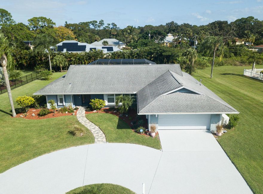 WELCOME TO PARADISE!  ELEGANT POOL HOME FEATURING 3 BEDROOMS, 2 FULL BATHROOMS AND WHOLE HOUSE GENERATOR ON PROFESSIONALLY LANDSCAPED .44 OF AN ACRE.  HOME HAS MARBLE TILE THROUGHOUT, CROWN MOLDING, IMPACT WINDOWS/SLIDERS AND PLANTATION SHUTTERS.  KITCHEN WITH CUSTOM WOOD CABINETS, GRANITE COUNTERTOPS AND S.S. APPLIANCES.   SPACIOUS LIVING ROOM OVERLOOKS THE BEAUTIFUL PAVER BRICK POOL/PATIO AREA WITH PRIVATE BACKYARD.  MASTER BEDROOM SUITE OVERLOOKS POOL/PATIO AREA, TOO.  GUEST BEDROOMS SHARE LOVELY BATHROOM THAT ALSO OPENS ONTO PATIO.  PATIO HAS LARGE GRANITE SNACKCOUNTER.  GREAT FOR ENTERTAINING! NEW CIRCULAR DRIVEWAY IN 10-23 WITH WARRANTY.  POOL RESURACED & NEW PUMP IN 2023.  NEW LANAI FLAT ROOF IN 10-23.  HOT WATER HEATER IN 2022.  A/C IN 2018.  GAS WHOLE HOUSE GENERATOR IN 2018 WITH 500 GALLON PROPANE TANK.  PREPARE TO BE IMPRESSED!  THIS IS A BEAUTY! SELLER DOES NOT WARRANTY POOL HEATER.  HOME IS MONITORED BY ADT-MONTHLY FEE $49.00.  EASY TO SHOW.