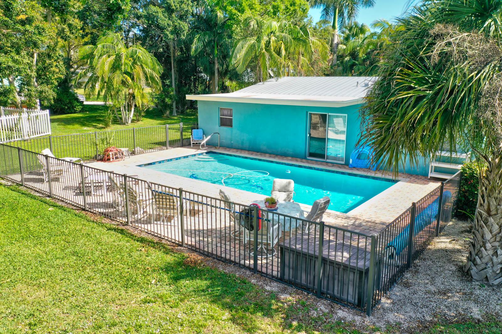 Tucked away like a well-kept secret along the serene North Fork of the St. Lucie River, this retreat blends Olde Florida charm with bold opportunity. Now offered at a sizzlin' hot price of $1,200,000, it invites you to envision more than just riverfront living--it's a lifestyle canvas for dreamers, creators, and nature lovers. With 285+ feet of waterfront, two docks, a private launch, and a tranquil studio hideaway, it's a rare offering poised for a timely transformation. Visit now--before the tides shift.
