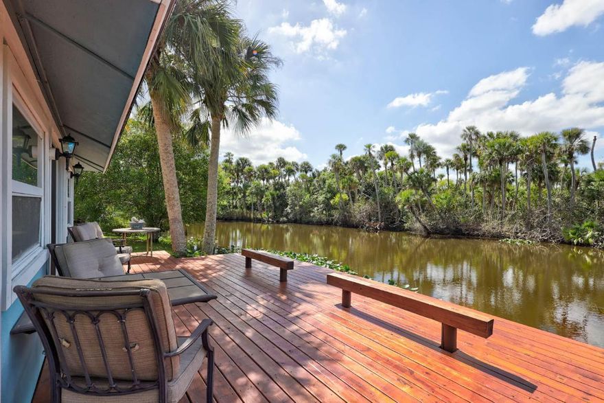 Tucked away like a well-kept secret along the serene North Fork of the St. Lucie River, this retreat blends Olde Florida charm with bold opportunity. Now offered at a sizzlin' hot price of $1,200,000, it invites you to envision more than just riverfront living—it's a lifestyle canvas for dreamers, creators, and nature lovers. With 285+ feet of waterfront, two docks, a private launch, and a tranquil studio hideaway, it's a rare offering poised for a timely transformation. Visit now—before the tides shift. Welcome to a truly rare Treasure Coast sanctuarywhere timeless riverside serenity meets bold market opportunity. Now available at a sizzlin' hot price of $1,200,000, this iconic slice of North Fork riverfront property is more than just a home; it's an invitation to live, create, and thrive surrounded by the beauty of Olde Florida.

Set on over 285 feet of direct waterfront, this estate features two private docksone equipped with a boat liftand a private launch pad for kayaks, paddleboards, or quick river-to-ocean escapes. Framed by mature palms and native flora, this property offers a feeling of seclusion while still being moments from the best of Port St. Lucie.

What sets this home apart isn't just the locationit's the experience. Imagine morning coffee as the mist lifts off the river, golden hour cocktails on the observation deck, or afternoons spent lounging by the pool, watching manatees drift by. A second dwellingformerly known as a guest househas been thoughtfully reimagined as a Riverside Studio. This versatile space is ideal for an artist's gallery, writer's loft, meditation den, or a tranquil spot for hosting creatives in residence.