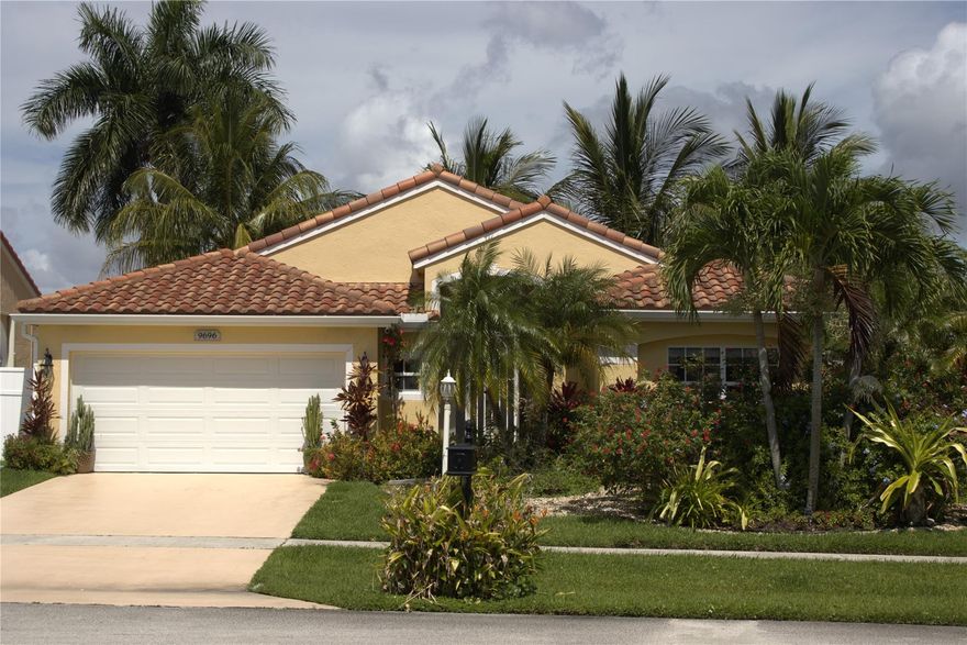 Light and bright open floor plan in this immaculate lake and canal view home. This home was pride of ownership with upgrades throughout. New Roof and tankless Water Heater (2017).  Impact windows & doors with wind mitigation and 4-pt inspection done in 2022. New AC and Whole house generator (liquid cooled 22kw, 500 gallon LPG) in 2019. Original polybutylene pipes replaced ($6600 upgrade) during remodel.  Newly renovated kitchen with Bahia Azul granite counters, subway tile backsplash, live edge floating dining table, pendant lights and updated appliances.  Master bathroom - floating vanity with granite countertops and vessel dual sinks; Heated floor and heated towel bar; light/sound bar above vanity with Bluetooth sound system.  Freshly painting inside and out. Low HOA community! Shower with 3 rainfall showerheads and Bluetooth speaker; Toto Washlet bidet system; under vanity motion detector with LED light. Guest bathroom has heated whirlpool bathtub and Toto Washlet bidet system.  Crown molding throughout. Tile flooring throughout; Garage with wall mounted cabinets, legless utility sink and Epoxy floor (2018).  Nest thermostat, ceiling fans in all rooms. Motorized window treatments on sliders and picture window. Popcorn ceiling removed. Extensive landscaping throughout property, Hunter Hydrawise wifi connected sprinkler controls (2019).  Rear patio awning and geometric patio deck with tiled rear patio and front porch.  Front landscape lighting.  New gutters (2020).  Great community with sport facilities such as 25-meter pool, basketball court, tennis, pickleball and playground.