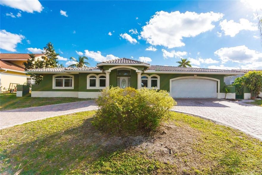 This waterfront pool home with 2 car garage is ready for updates to become the house of your dreams. It sits 4 homes off the Intracoastal and is located on a gated island cul de sac in one of the best areas of Pompano Beach. It is ideal for the boating enthusiast with a new protected dock for up to a 70 ft boat with NO fixed bridges and a short ride to the Inlet. The home is spacious with a triple split layout and versatile floor plan that could be reimagined to a modern design. Entertainers will love the living areas that access a huge covered patio overlooking the pool, spa and water, ideal for outdoor living. The kitchen is huge and primed to be opened up to the living dining areas.  The neighborhood is secure and close to excellent shopping, dining, golf and a short ride to the beach.