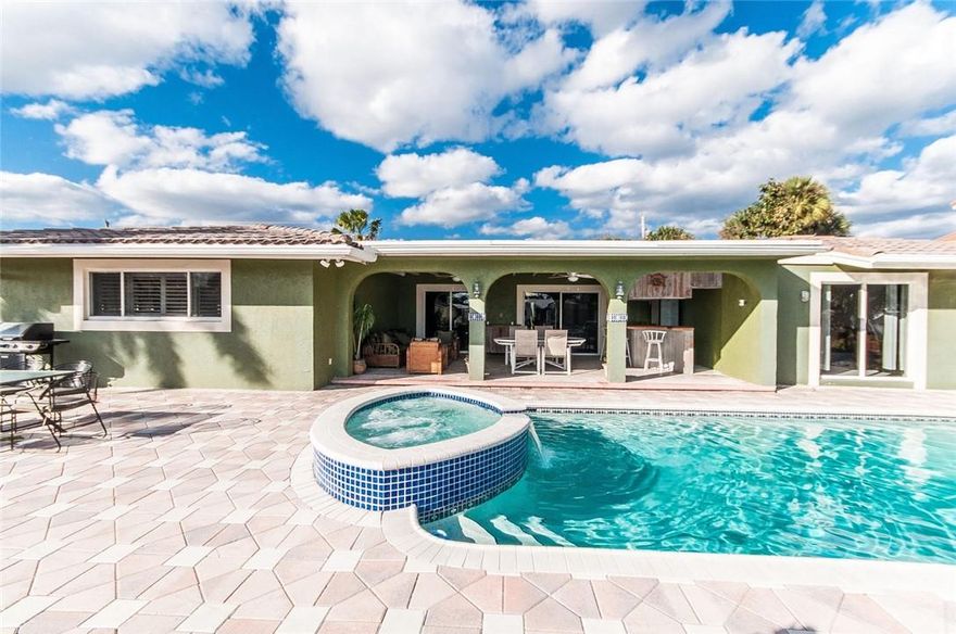 This waterfront pool home with 2 car garage is ready for updates to become the house of your dreams. It sits 4 homes off the Intracoastal and is located on a gated island cul de sac in one of the best areas of Pompano Beach. It is ideal for the boating enthusiast with a new protected dock for up to a 70 ft boat with NO fixed bridges and a short ride to the Inlet. The home is spacious with a triple split layout and versatile floor plan that could be reimagined to a modern design. Entertainers will love the living areas that access a huge covered patio overlooking the pool, spa and water, ideal for outdoor living. The kitchen is huge and primed to be opened up to the living dining areas.  The neighborhood is secure and close to excellent shopping, dining, golf and a short ride to the beach.