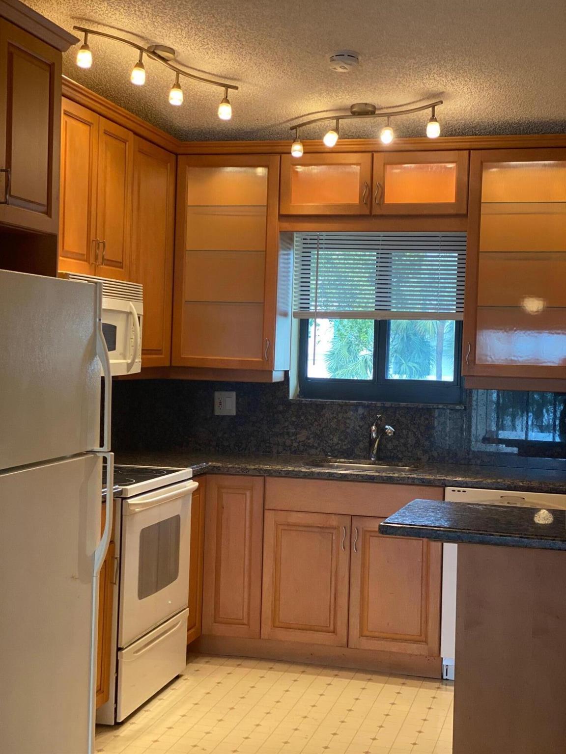 Beautiful second floor unit with lake view and high ceiling. No carpet. You must see!