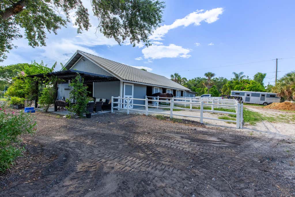 Photo of 844 Arabian Drive, Loxahatchee, FL 33470 (MLS # B26047577)