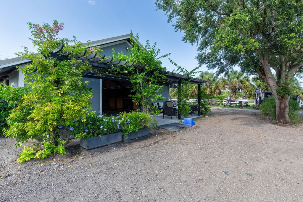 Photo of 844 Arabian Drive, Loxahatchee, FL 33470 (MLS # B26047577)