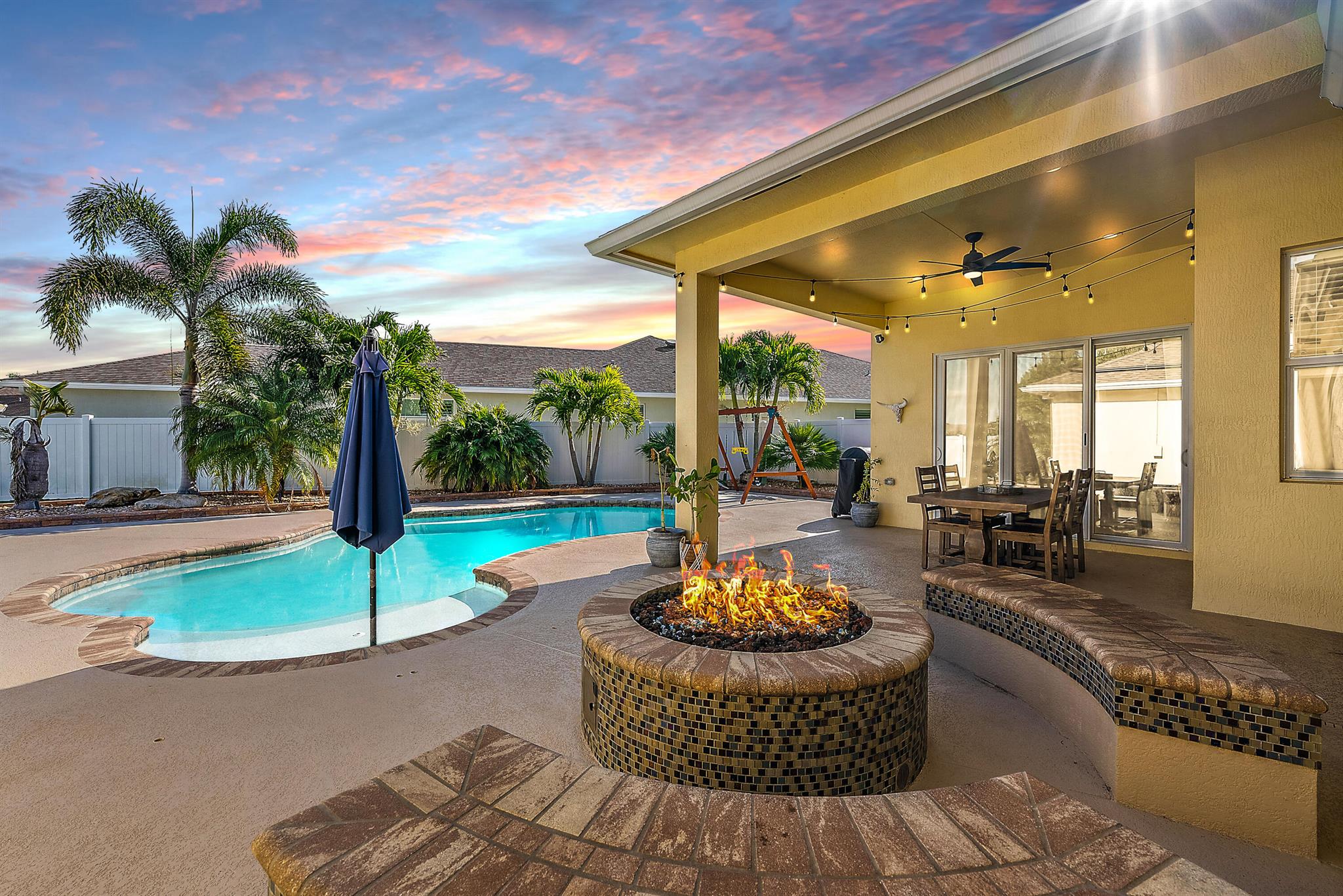 LEASED for one year beginning 6/1/2025. Experience the ultimate resort-style retreat in this 3-bedroom home, with flexible den or extra private bedroom, along with 2 full bathrooms. Features include, Complete impact windows, New luxury vinyl plank (LVP) flooring with 5'' baseboards, Newer appliances, Newer gas cooktop, and Newer LG Thinq front-loading washer and dryer with utility sink. New alkaline water filtration system for pristine drinking water. Updated lighting fixtures throughout. Freshly painted throughout. The primary suite offers a cozy nook perfect for an office, nursery, or reading area. The ensuite features dual sinks, his-and-hers walk-in closets with organizers, and a large custom tiled walk-in shower.