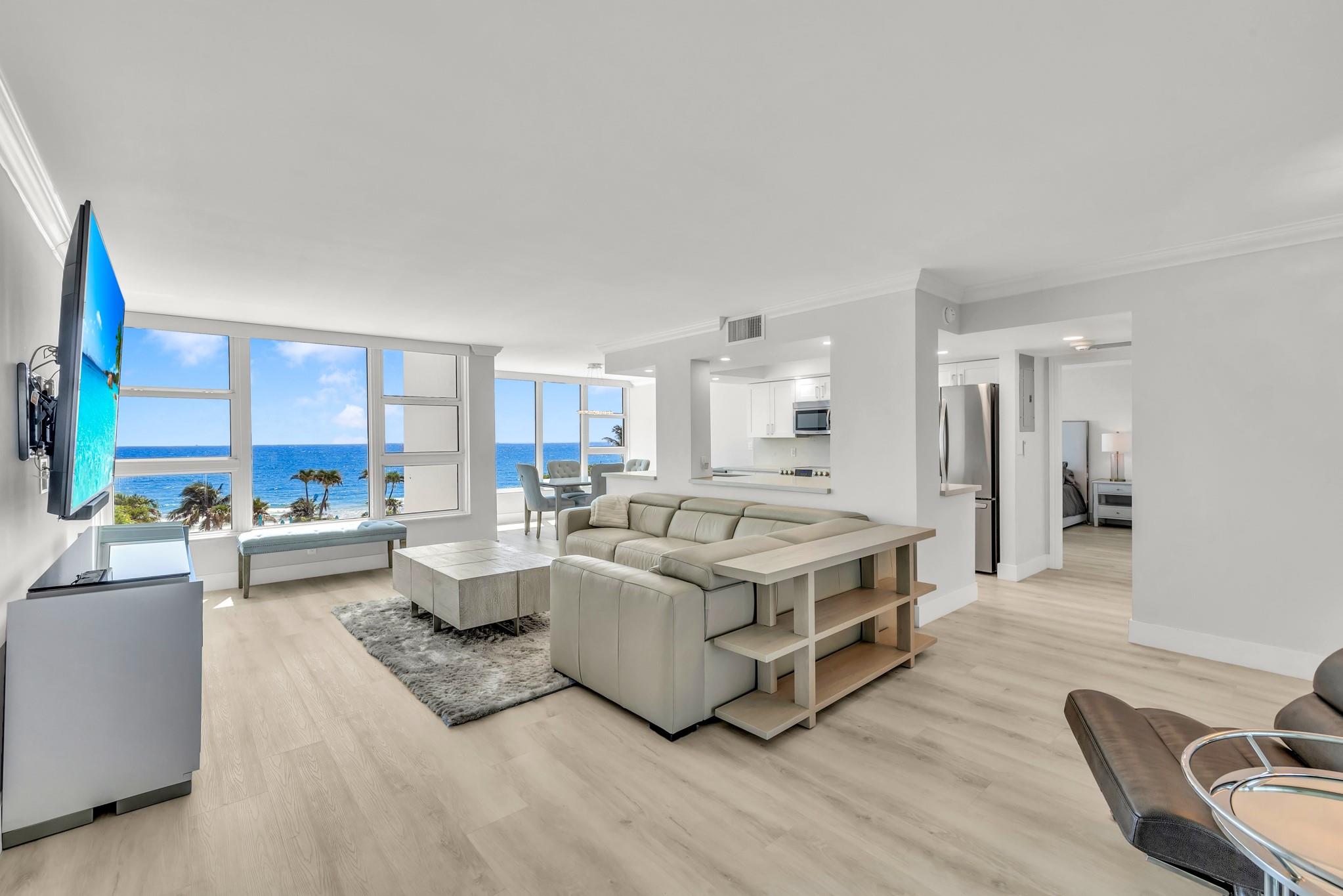 DIRECT OCEAN VIEWS FROM EVERY WINDOW AND THE BALCONY at the Ocean Colony. Spectacular FURNISHED Professionally Renovated large 1 Bedroom with 2 FULL Bathrooms. Directly on the sand and located within walking distance of the Lauderdale by the Sea and Pompano Beach Piers with bars, restaurants, shopping. 24 hour Guard at the Gate. ALL HIGH IMPACT WINDOWS & DOORS. Premium amenities featuring resort style pool, gym, sauna, game room, billiard room and use of the Aquazul tennis court. Lease is for a min of 6 months and 1 day. AVAILABLE FOR IMMEDIATE OCCUPANCY. Rent includes: WiFi, premium cable, electric, water, garage parking for 1 vehicle, and ample parking for guests. Completely turnkey with high end furniture, 85" TV, sheets, towels, kitchenwares, and cooking utensils. IN UNIT WASHER DRYER