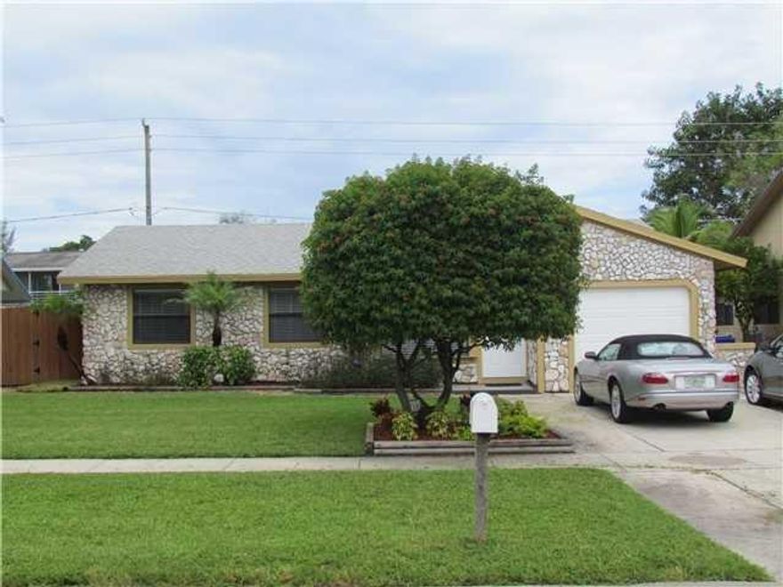 WOW, Here is the nice home in a friendly neighborhood, which is close to everything! This home has been upgraded with impact glass, has a super, light and bright large rear family room with soaring ceilings. French doors lead to a an adorable backyard, appointed with an adorable gazeebo and plenty of room for a pool. There are no laundry machines in the garage or air handlers in a bedroom closet, for this home has an indoor laundry/utility room. Open Showings Today, Sunday:12:30-3pm