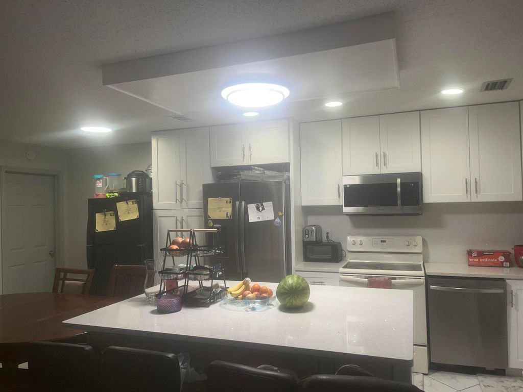 Photo of 1322 Pines Lane, West Palm Beach, FL 33415 (MLS # B26018823)