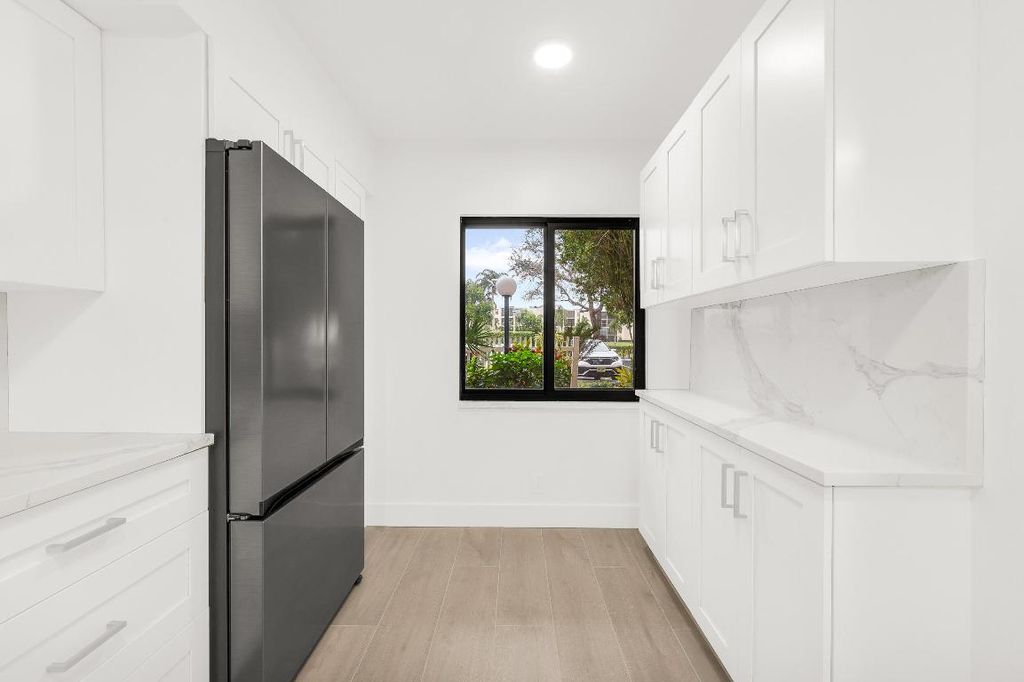 Photo of 7290 Kinghurst Drive #102, Delray Beach, FL 33446 (MLS # R11155113)
