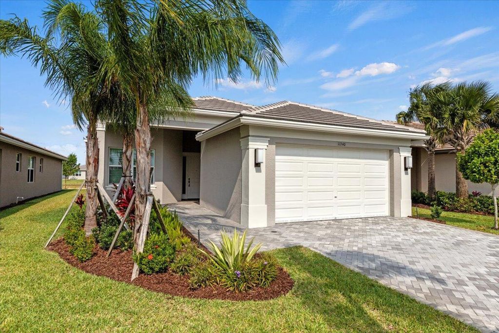 Photo of 11740 SW Moon River Way, Port Saint Lucie, FL 34987 (MLS # R10987831)