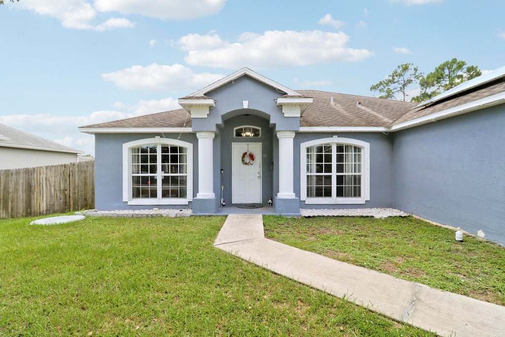 Photo of 1850 SW ALTMAN Avenue, Port Saint Lucie, FL 34953 (MLS # B26063679)