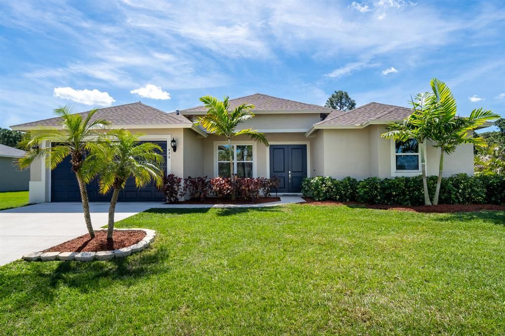 Photo of 998 SW Tunis Avenue, Port Saint Lucie, FL 34953 (MLS # R10697614)