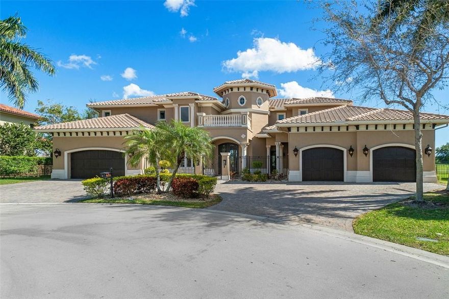 Spectacular Home On Oversized, Private, Waterfront Cul De Sac Lot In Heron Estates! 6 Bedrooms plus Bonus Room, 5 Full Bathrooms And 2 Half Bathrooms Plus 12 Seat Theatre Room. Separate Office and Bar Room. Custom Built With All The Bells And Whistles. Jerusalem Tile Throughout, Real Wood and Marble Floors. Separate Wet Bar/Butlers Pantry With Wine Fridge, Gourmet Kitchen With Sub Zero Refrigerator, 2 Dishwashers, 6 Burner Gas Stove Top And Thermador Ovens. Master Bedroom Upstairs With Office And His And Her Custom Built Closets. Master Bathroom Has His And Her Sinks And Separate Vanity Area. Laundry Room Has 2 Washers And 2 Dryers With Dog Wash, Shower Area. Fenced Yard With Summer Kitchen With Bar Seating And Oversized Pool Overlooking Lake. Impact Glass.