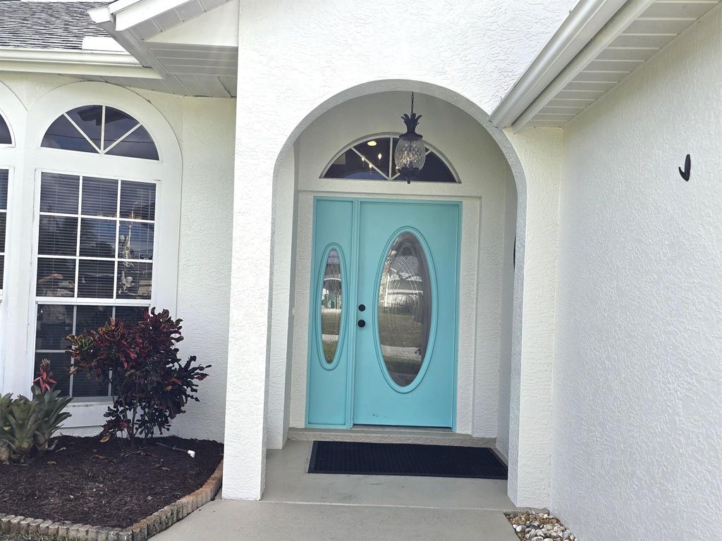 Photo of 451 SE Cork Road, Port Saint Lucie, FL 34984 (MLS # R11133496)