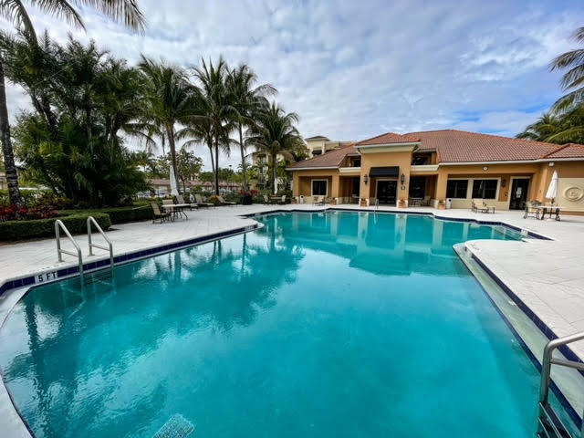 Beautiful split bedroom condo, in a secure gated community steps away from restaurant row and grocery stores. . Building next to the Clubhouse and guest parking. Unit has a one car garage with driveway,! Large living/dining area with crown molding. Kitchen has granite counters and stainless appliances. AC replaced in 2020 with the addition of UV to improve air quality, Impact windows for peace of mind. Master Bath has two sinks, large tub and separate shower. Second Bath has large shower. The Worth floor plan is one of the most popular at Midtown. Spacious balcony off of the living room is a great spot for relaxing and also has a storage closet. Wood look flooring in living area and carpet in bedrooms. Complex has beautiful clubhouse with gym, heated pool/spa, and tennis court.