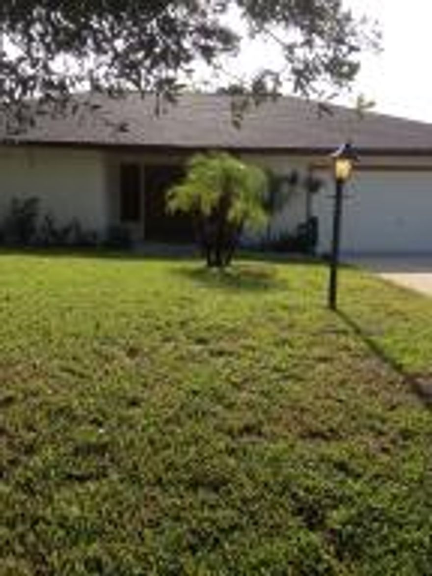 WOW MOVE-IN-CONDITION - 1815 AC - OVERSIZED 2 CAR GARAGE - LARGE SCREENED PORCH - FENCED YARD - CITY WATER & SEWER - NEW ROOF 2007 - NEW AC 2008 -TILE IN KITCHEN/FAMILY ROOM & BOTH BATHROOMS - LAMINATE FLOORING IN LIV ROOM/MASTER BEDROOM - CROWN MOLDING IN KITCHEN/FAMILY ROOM & MASTER BEDROOM.SECURITY SYSTEM & MUCH MUCH MORE.